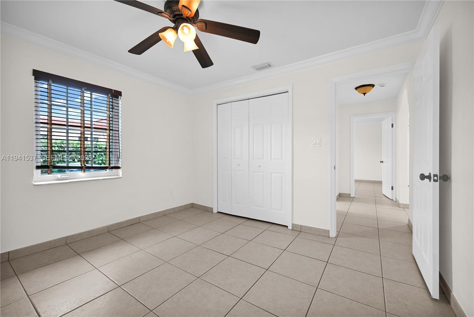 6560 Southwest 39th Street Miami, FL 33155 - Photo 4 of 17 a view of an empty room and window