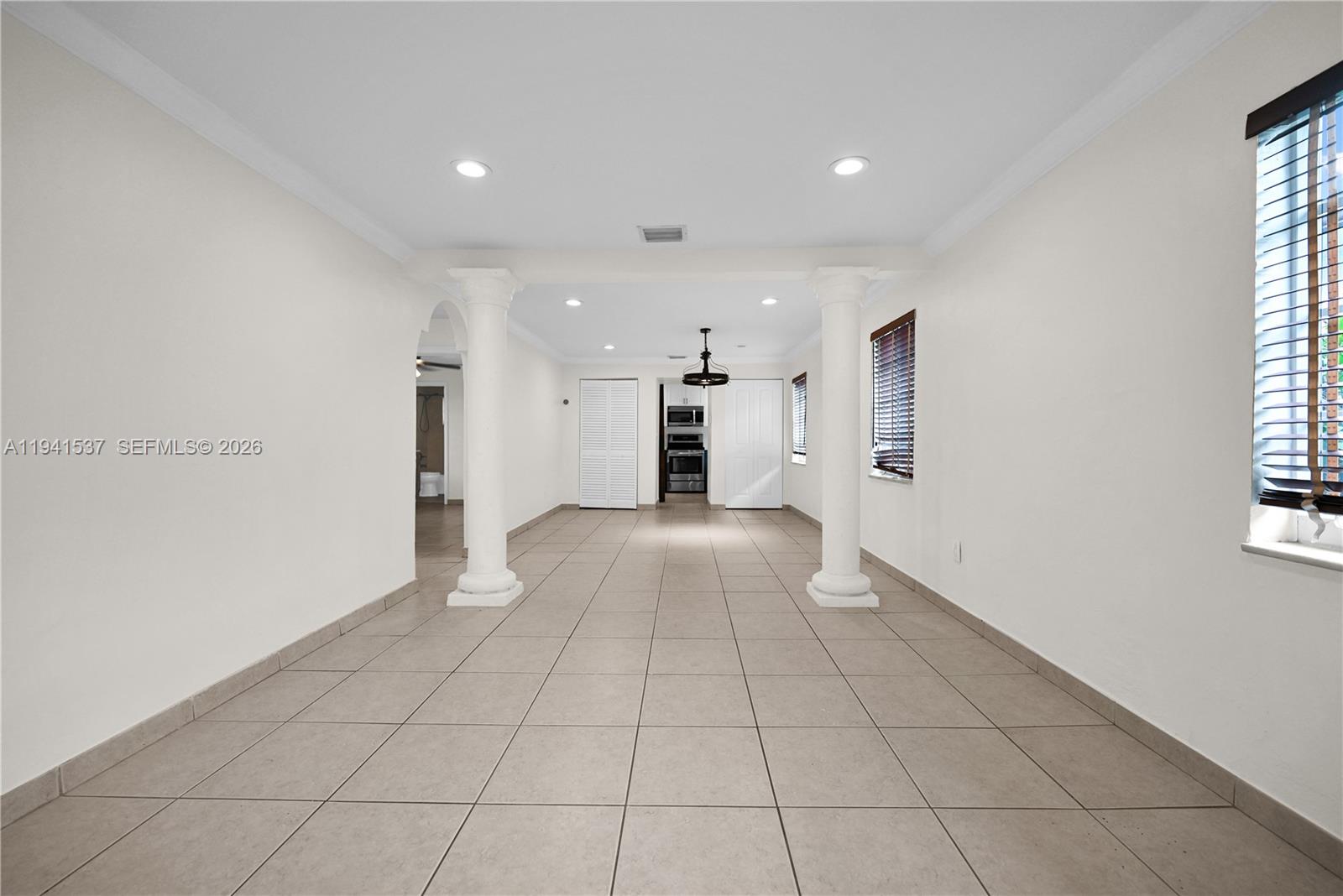 6560 Southwest 39th Street Miami, FL 33155 - Photo 9 of 17 a view of a living room a window and a refrigerator