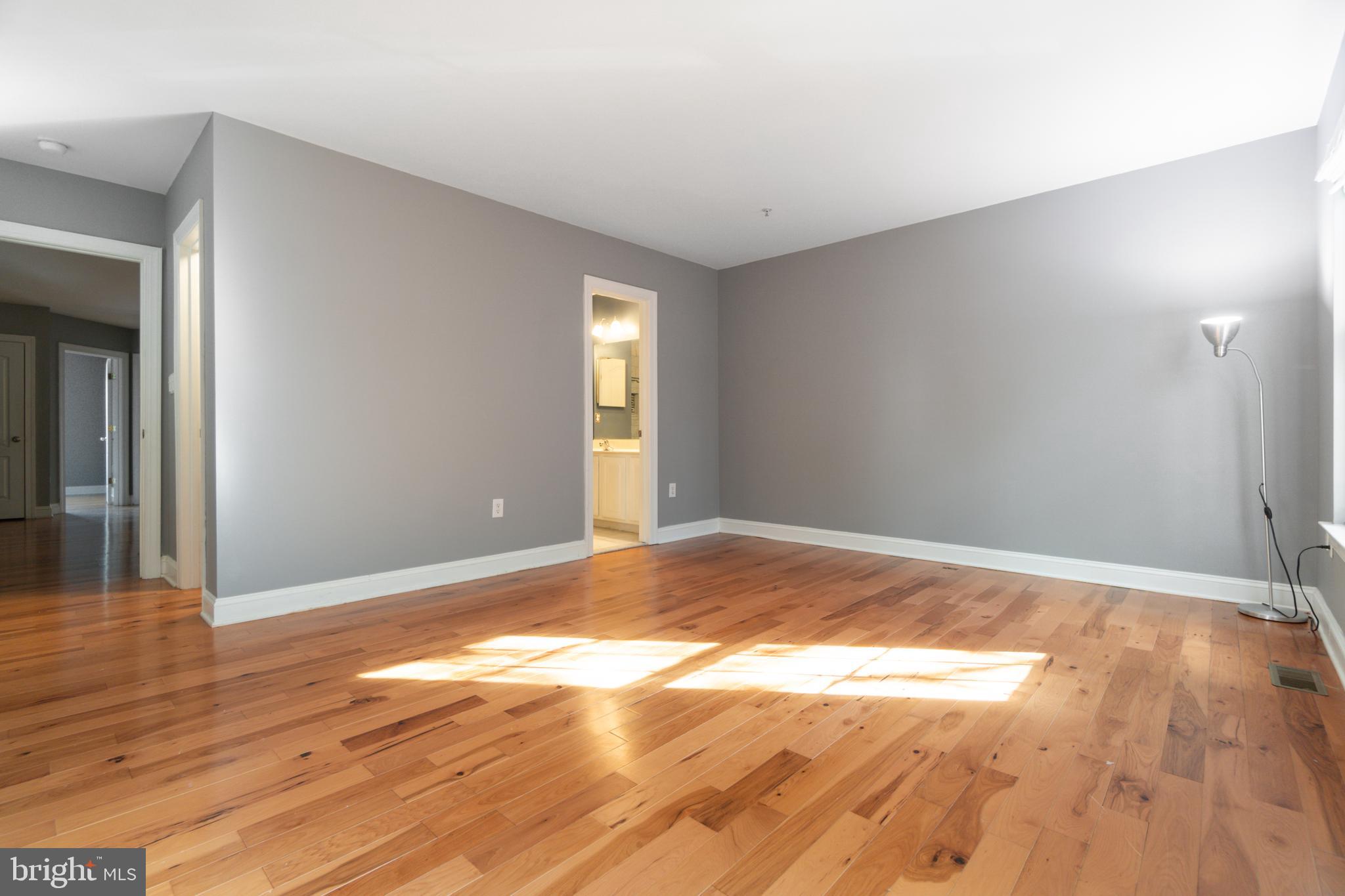 104 Bucksfield Road, Unit 104 Gaithersburg, MD 20878 - Photo 16 of 39 a view of empty room with wooden floor