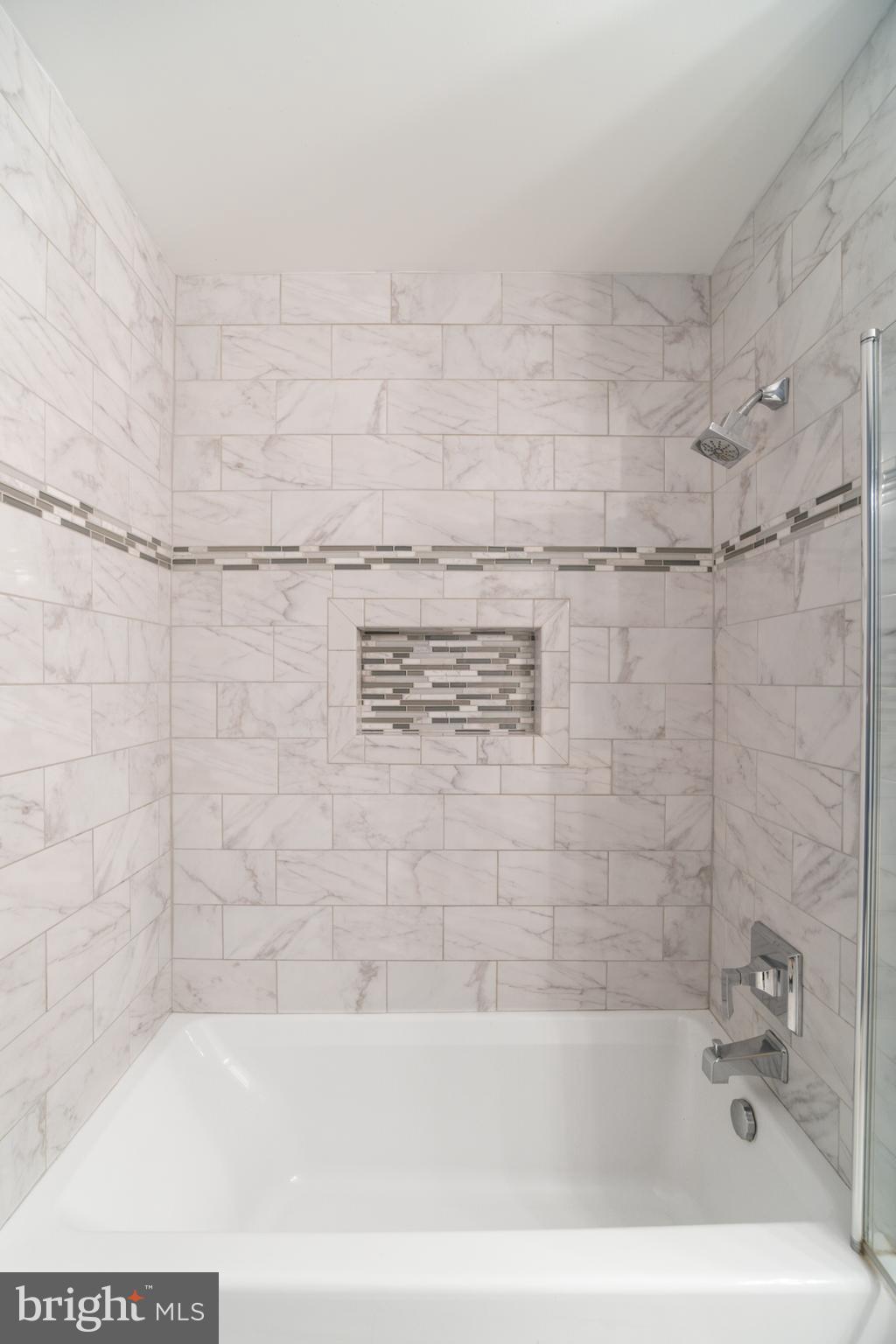 104 Bucksfield Road, Unit 104 Gaithersburg, MD 20878 - Photo 19 of 39 a bathroom with a bathtub and shower