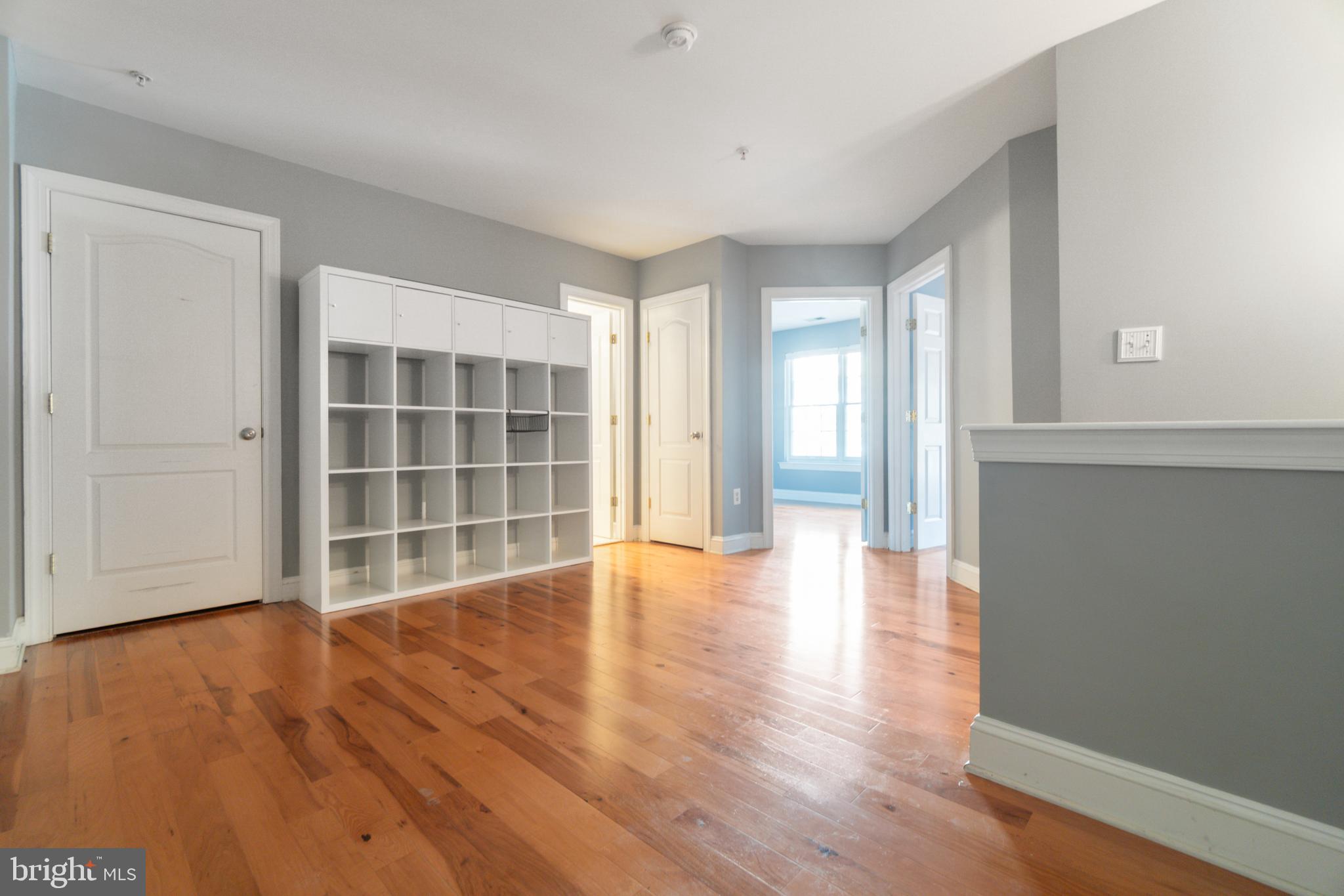 104 Bucksfield Road, Unit 104 Gaithersburg, MD 20878 - Photo 21 of 39 wooden floor in an empty room with a window