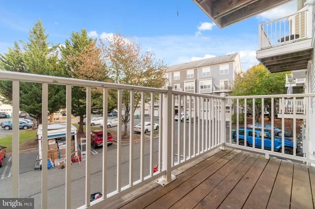 a view of a balcony with chairs
