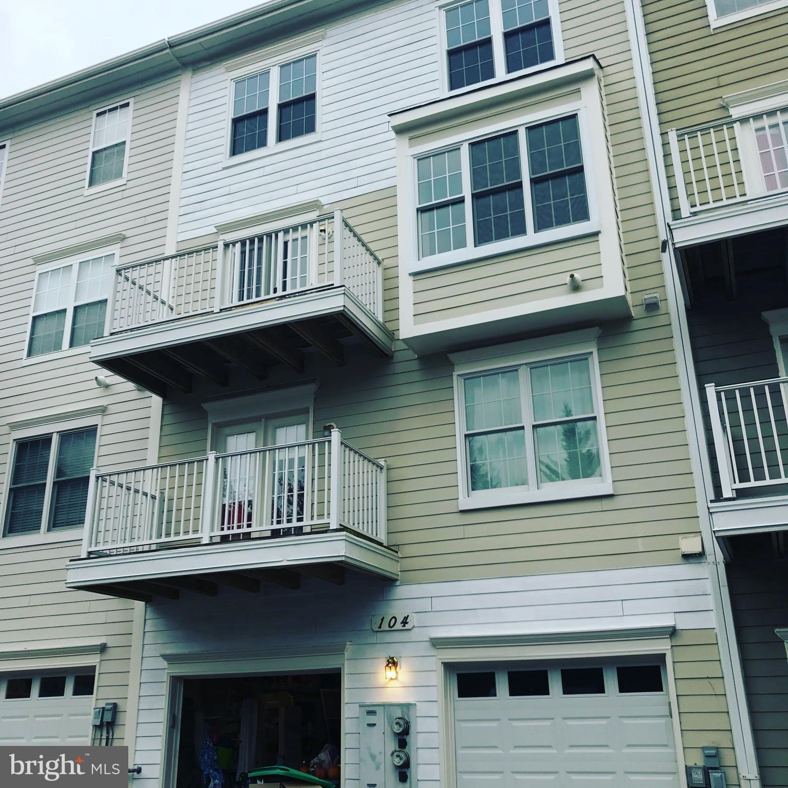 104 Bucksfield Road, Unit 104 Gaithersburg, MD 20878 - Photo 30 of 39 a view of building with a lot of windows