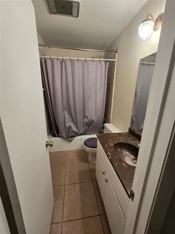 a kitchen with a stove and a refrigerator