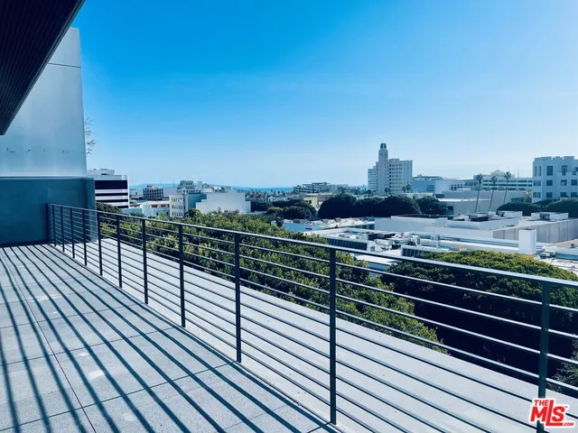 a view of a balcony with city view