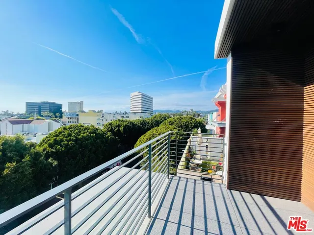 a view of balcony with wooden floor and outdoor space