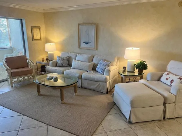 a living room with furniture and a table