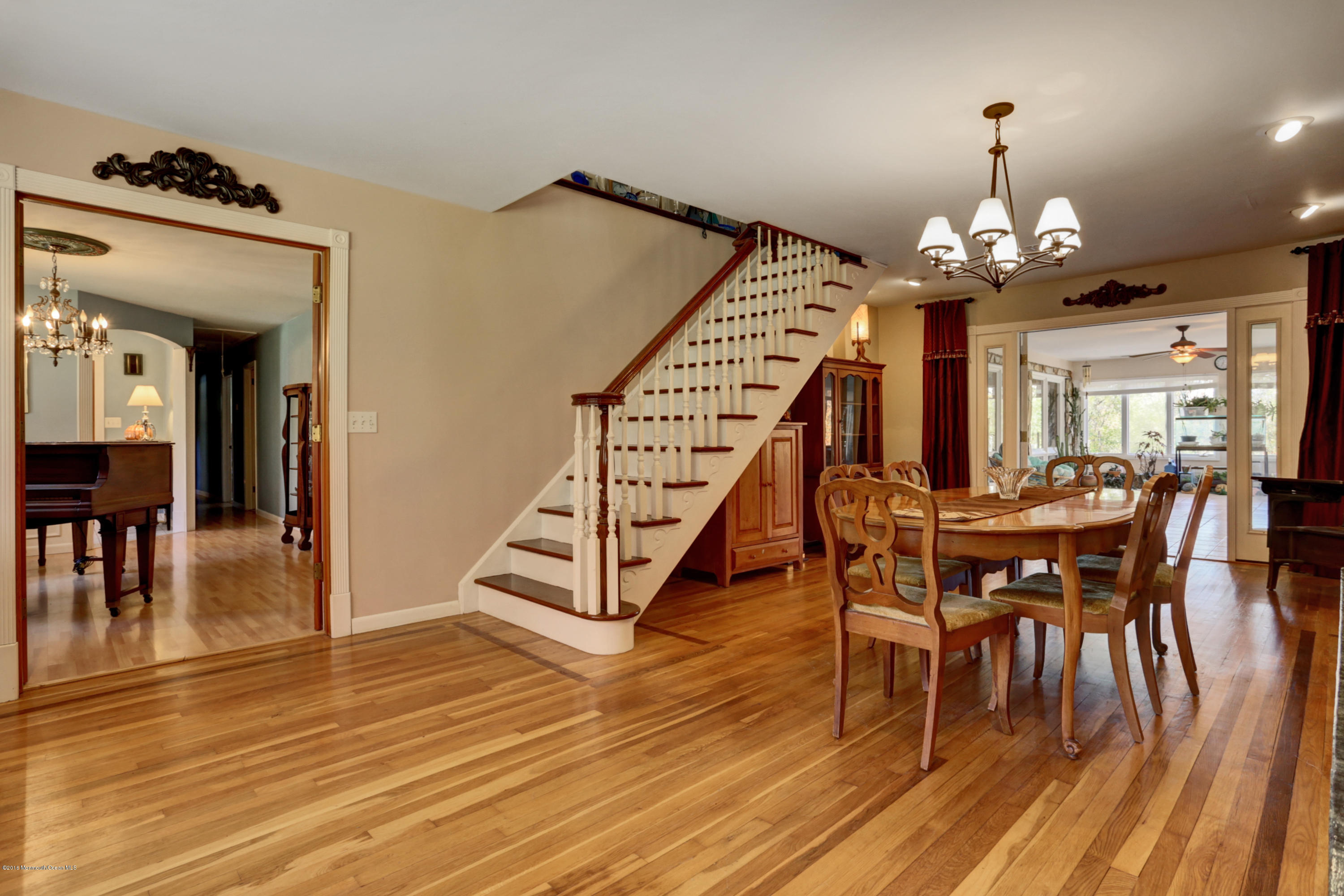 255 Portland Road Middletown, NJ 07737 - Photo 11 of 41 a view of a dining room with furniture and wooden floor