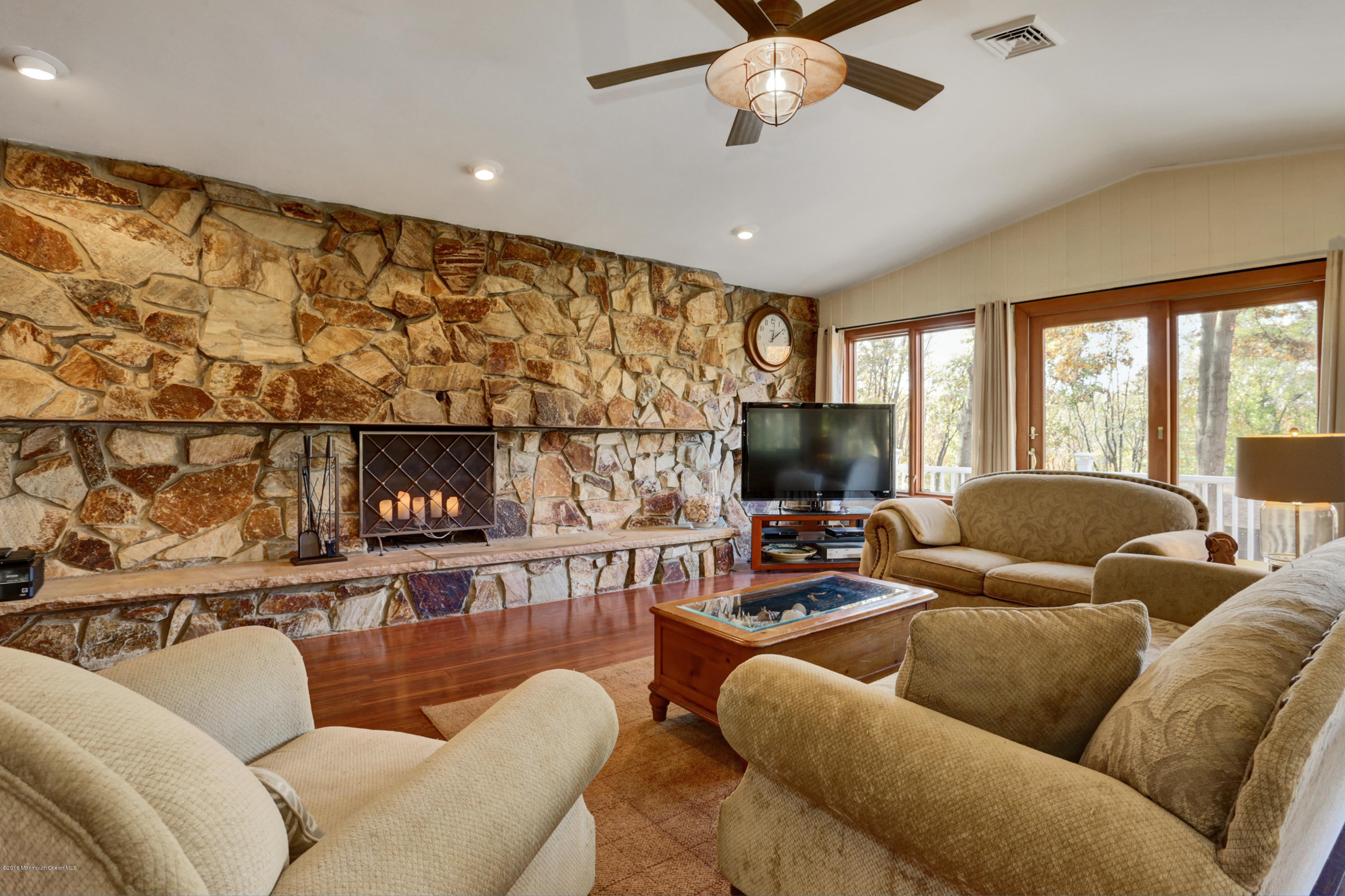 255 Portland Road Middletown, NJ 07737 - Photo 13 of 41 a living room with furniture and a flat screen tv