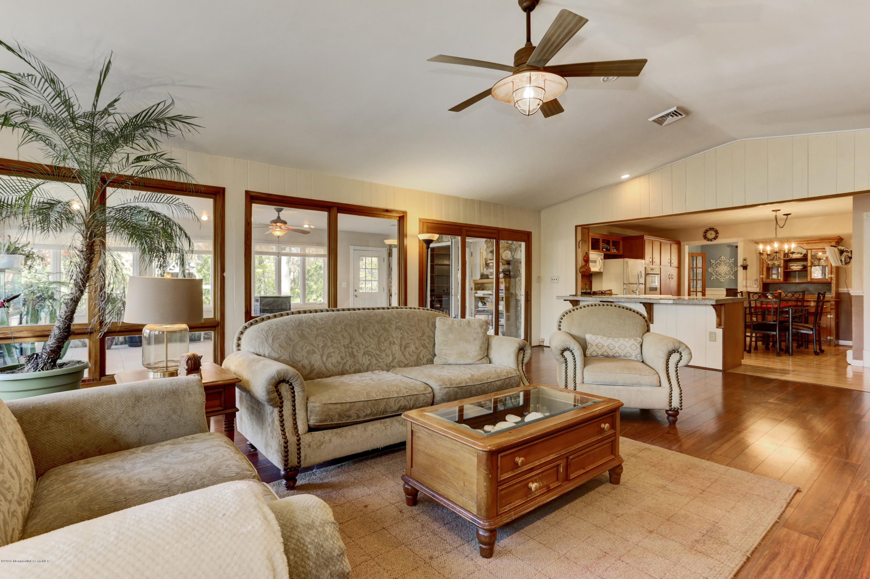 255 Portland Road Middletown, NJ 07737 - Photo 15 of 41 a living room with furniture ceiling fan and a rug