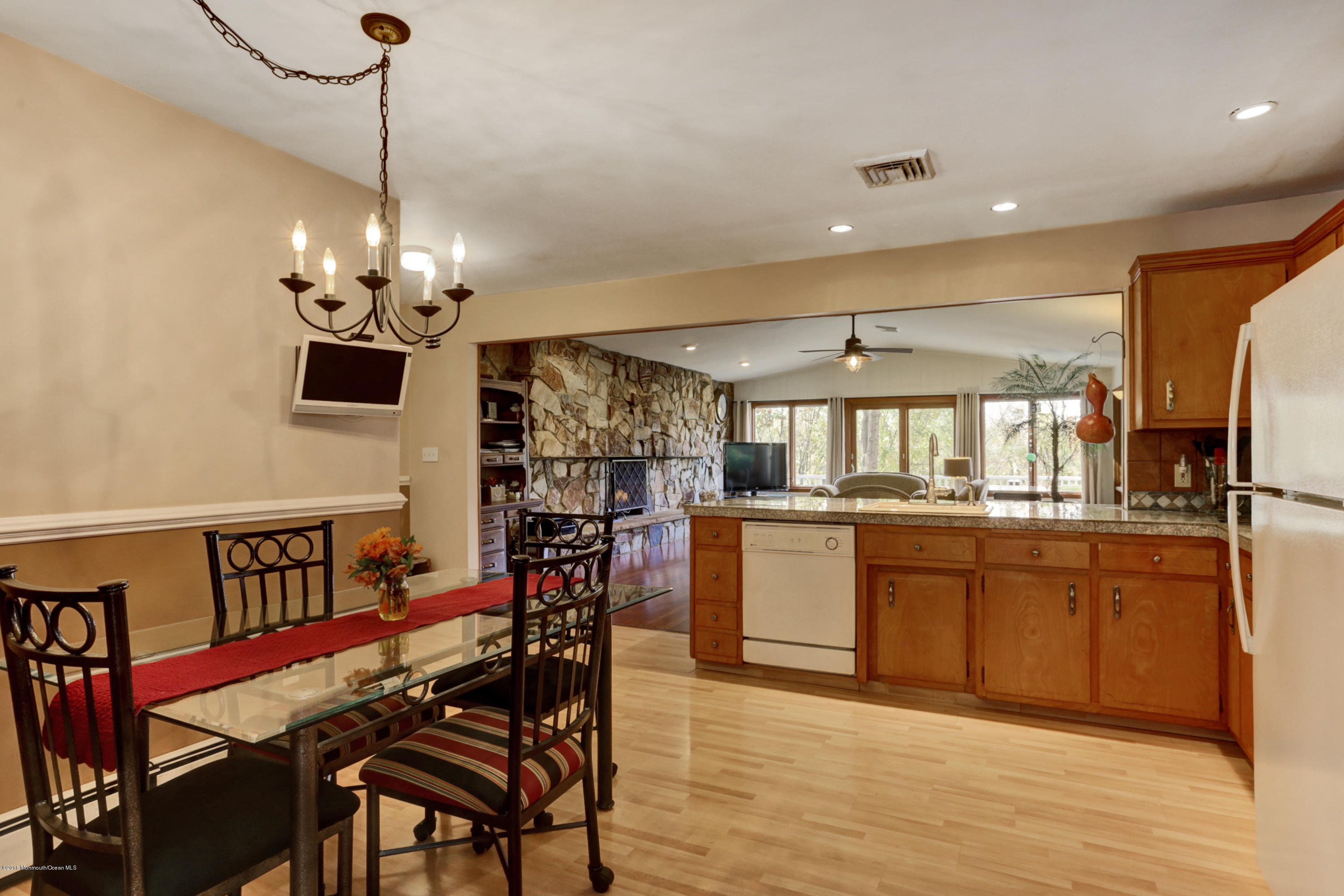 255 Portland Road Middletown, NJ 07737 - Photo 18 of 41 a view of a dining room with furniture window and wooden floor