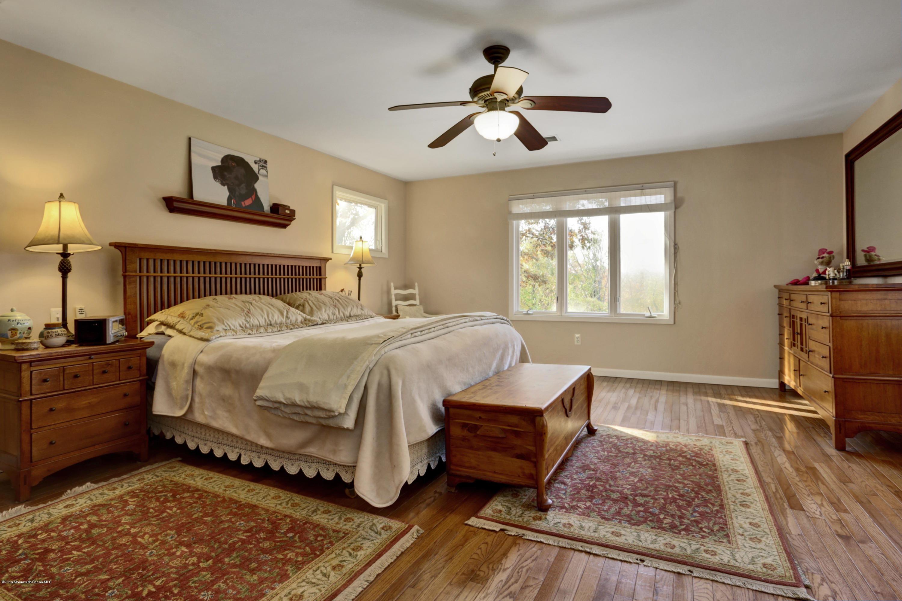 255 Portland Road Middletown, NJ 07737 - Photo 19 of 41 a bedroom with a bed and wooden floor