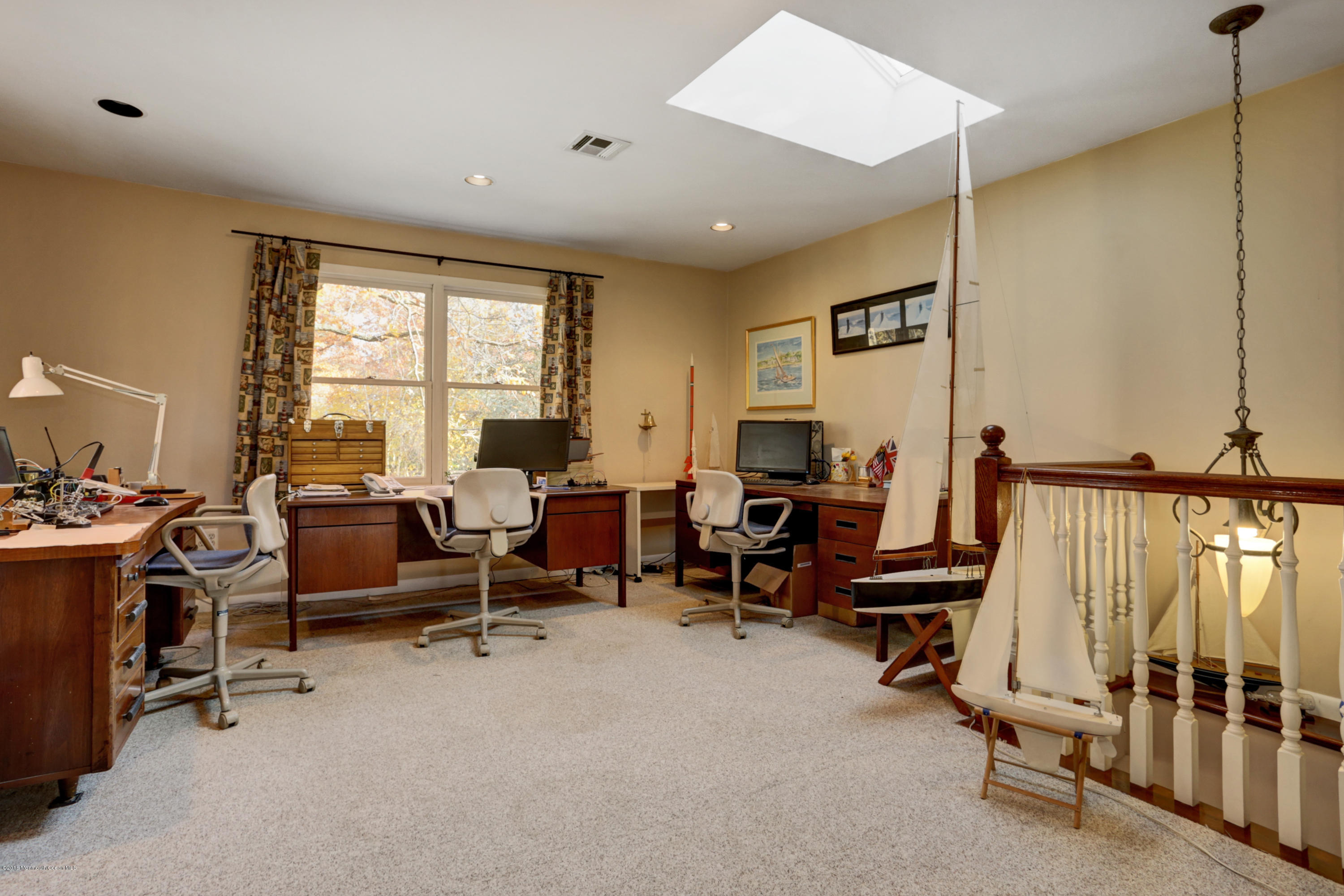 255 Portland Road Middletown, NJ 07737 - Photo 21 of 41 a living room with furniture gym equipment and a window