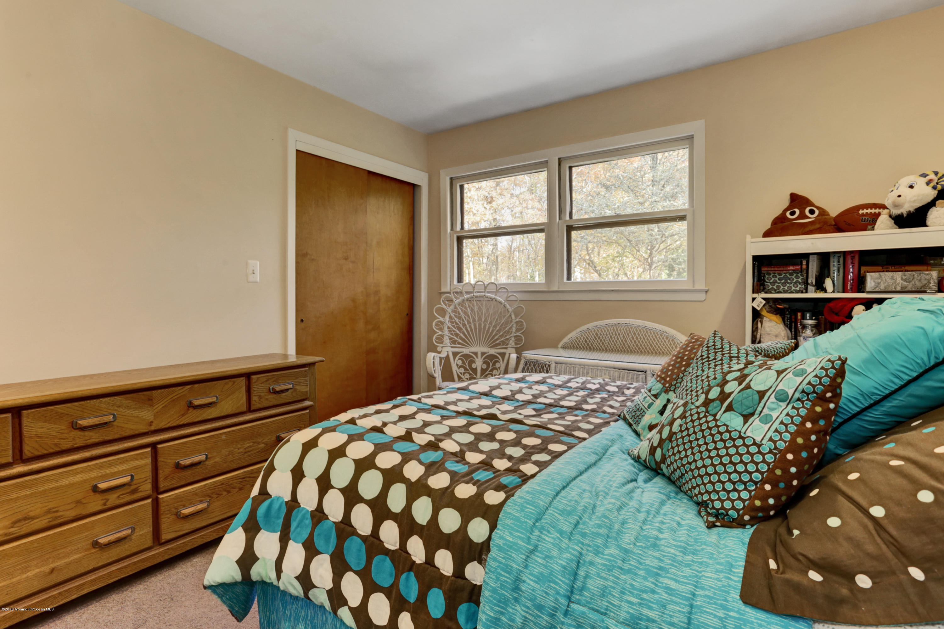255 Portland Road Middletown, NJ 07737 - Photo 22 of 41 a bedroom with a bed and a window