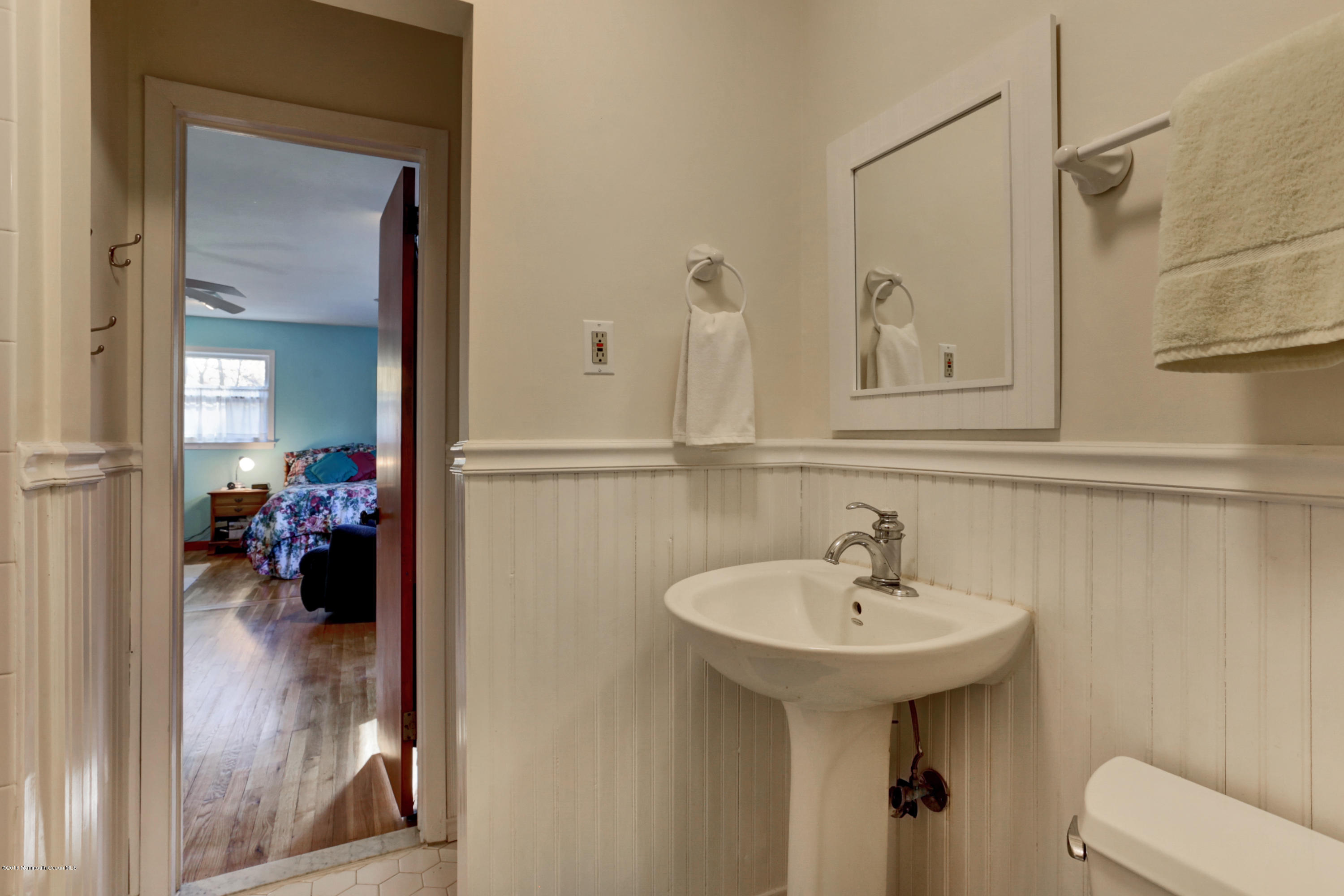 255 Portland Road Middletown, NJ 07737 - Photo 26 of 41 a bathroom with a sink and a mirror