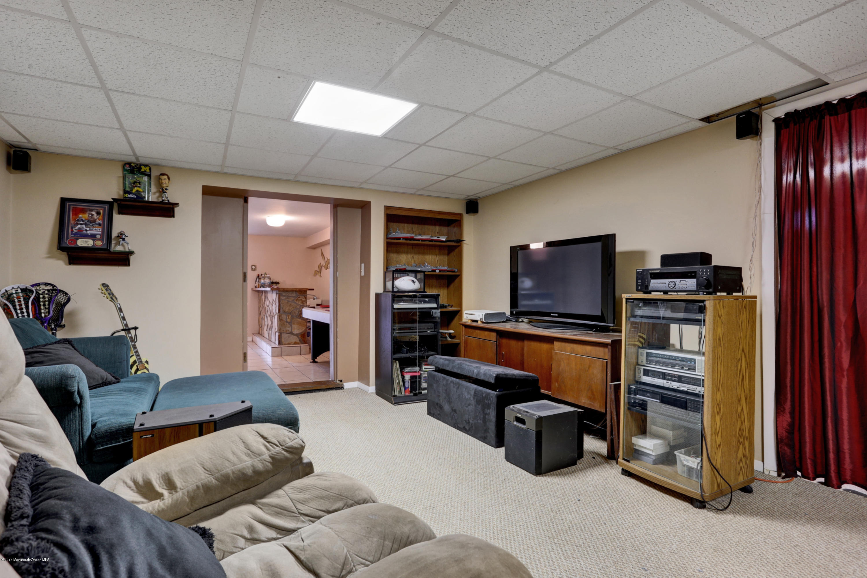 255 Portland Road Middletown, NJ 07737 - Photo 27 of 41 a bedroom with furniture and a flat screen tv