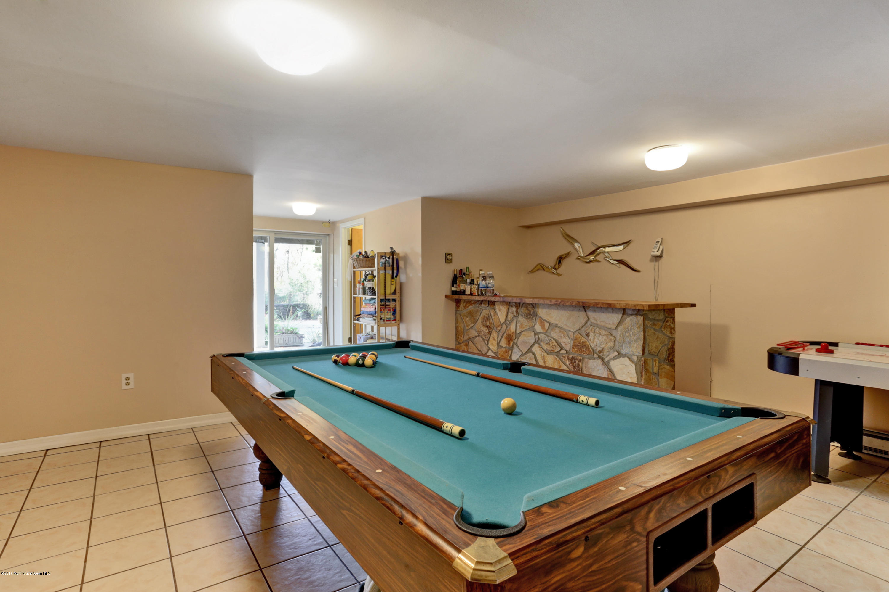 255 Portland Road Middletown, NJ 07737 - Photo 28 of 41 a room with pool table and windows