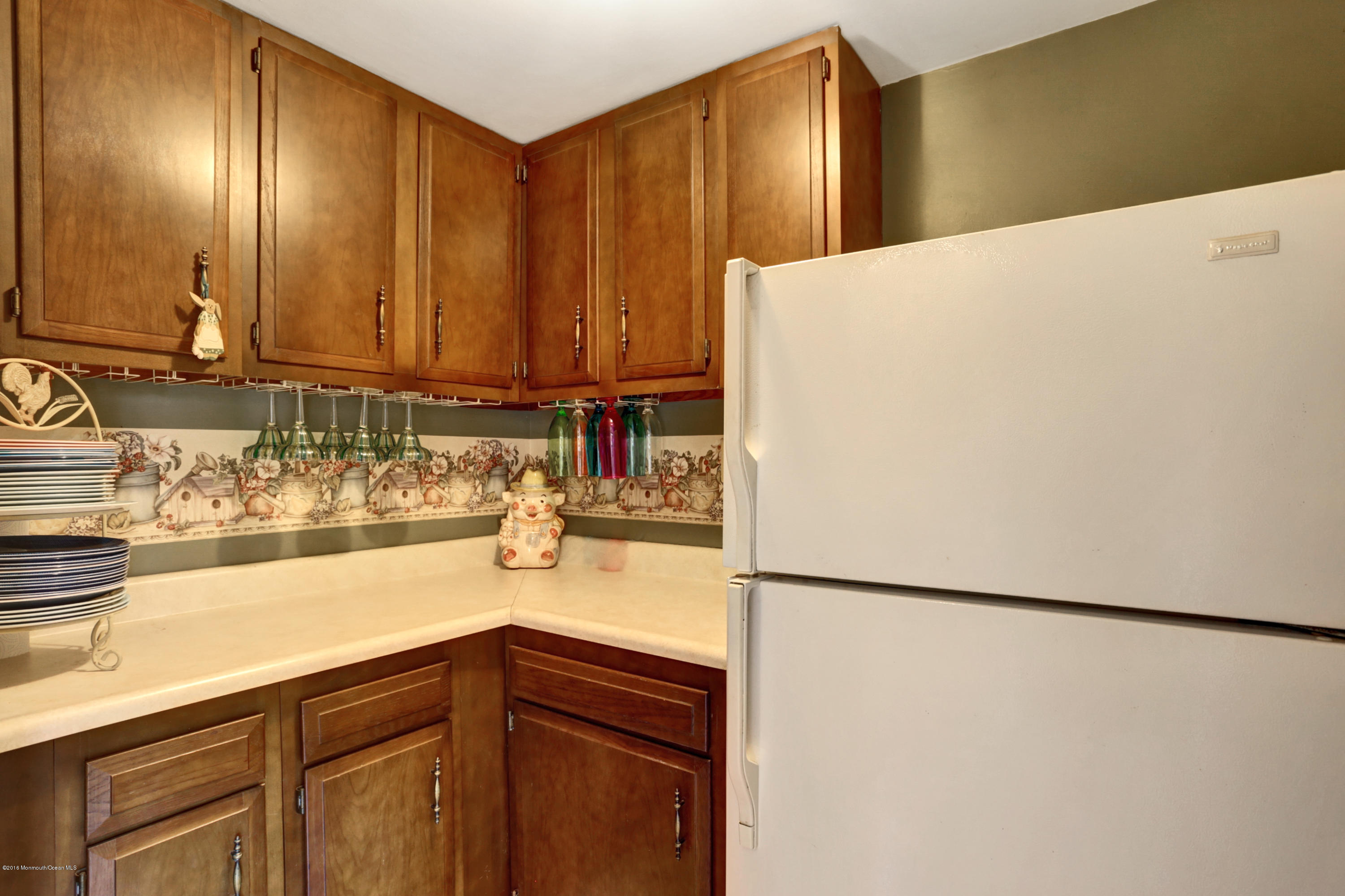 255 Portland Road Middletown, NJ 07737 - Photo 29 of 41 a kitchen with a refrigerator and cabinets