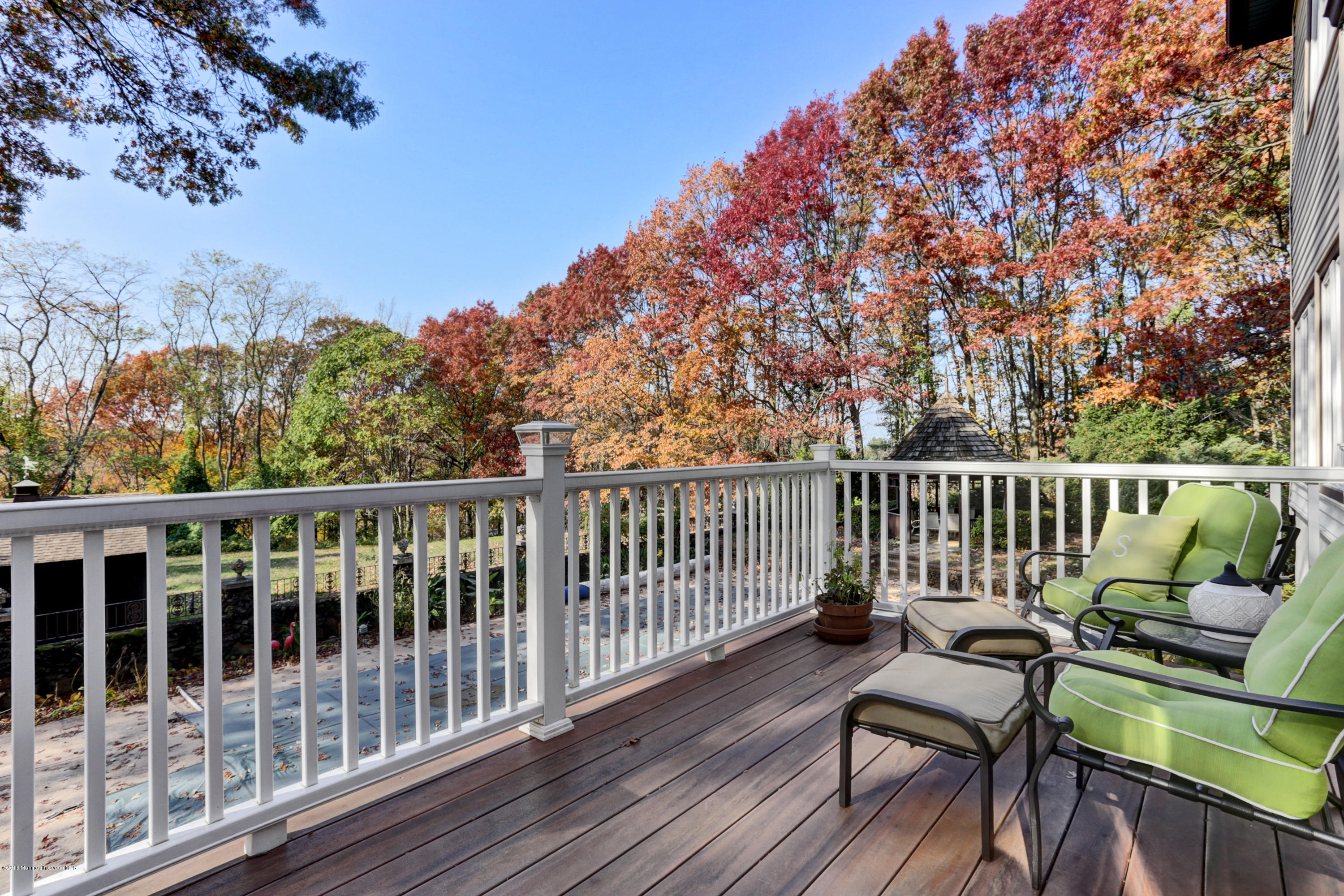 255 Portland Road Middletown, NJ 07737 - Photo 30 of 41 a view of a two chairs on the deck