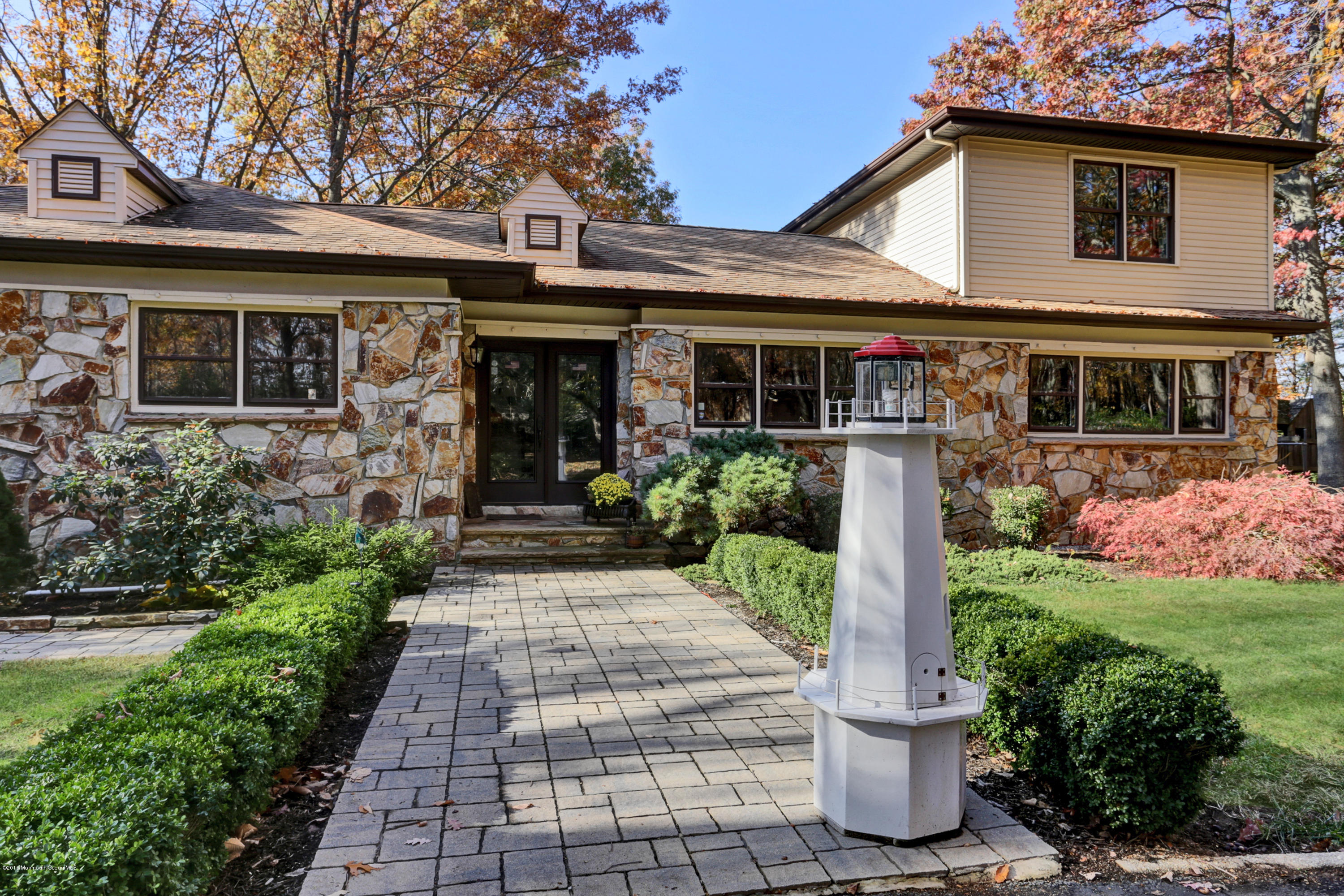 255 Portland Road Middletown, NJ 07737 - Photo 4 of 41 a front view of a house with garden