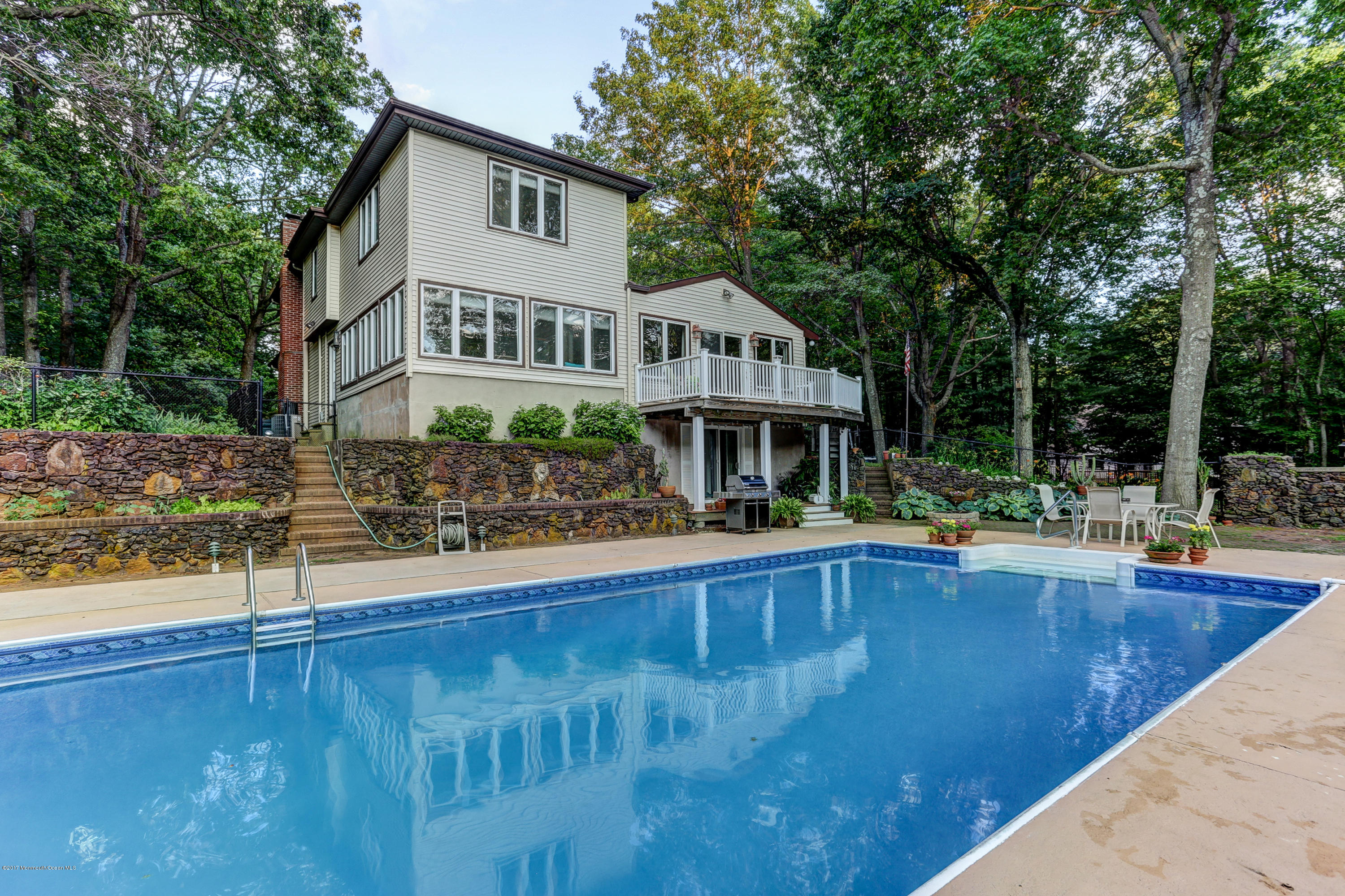 255 Portland Road Middletown, NJ 07737 - Photo 34 of 41 a view of house with yard outdoor seating and swimming pool