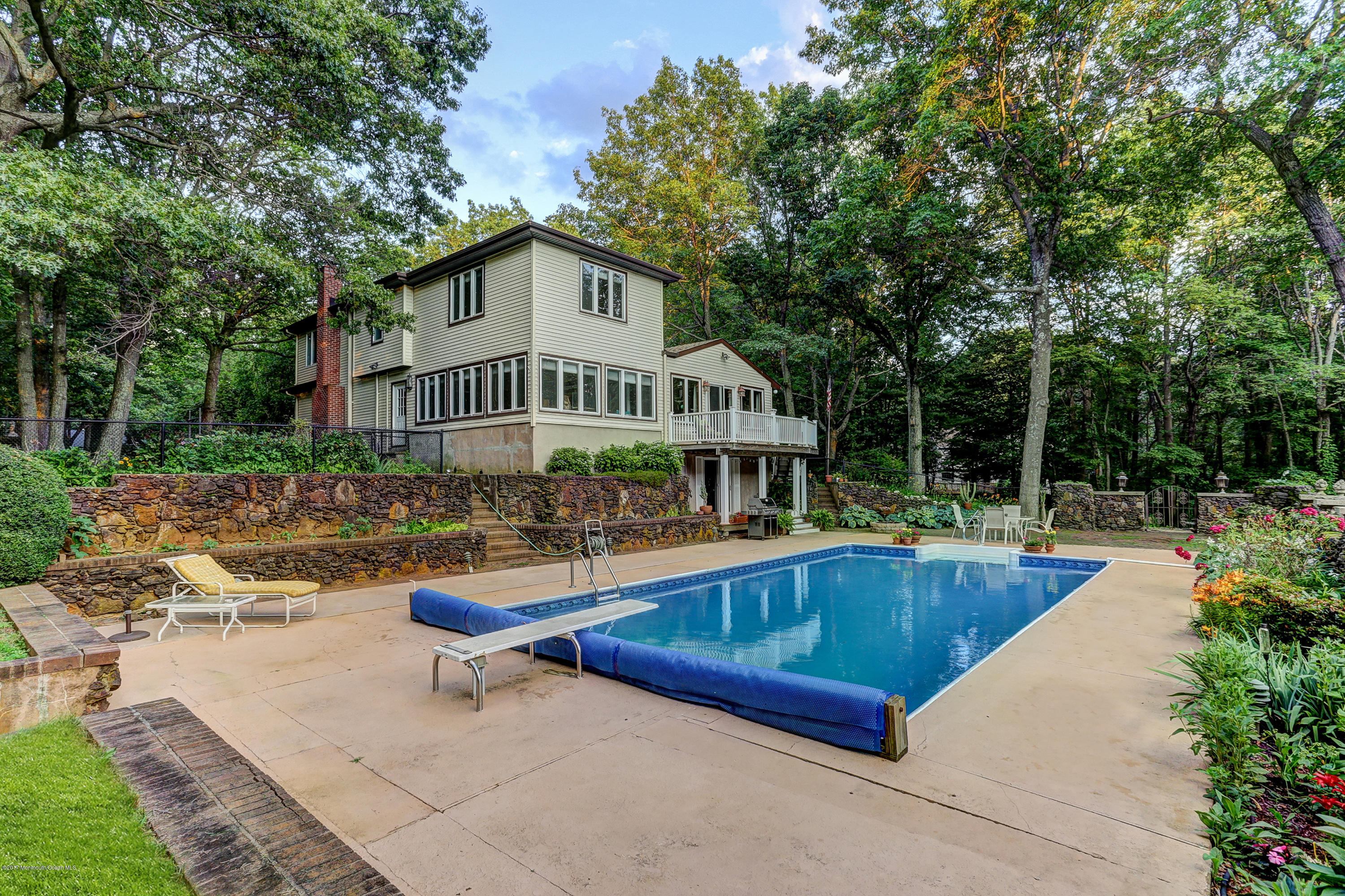 255 Portland Road Middletown, NJ 07737 - Photo 35 of 41 a view of a house with pool and sitting area