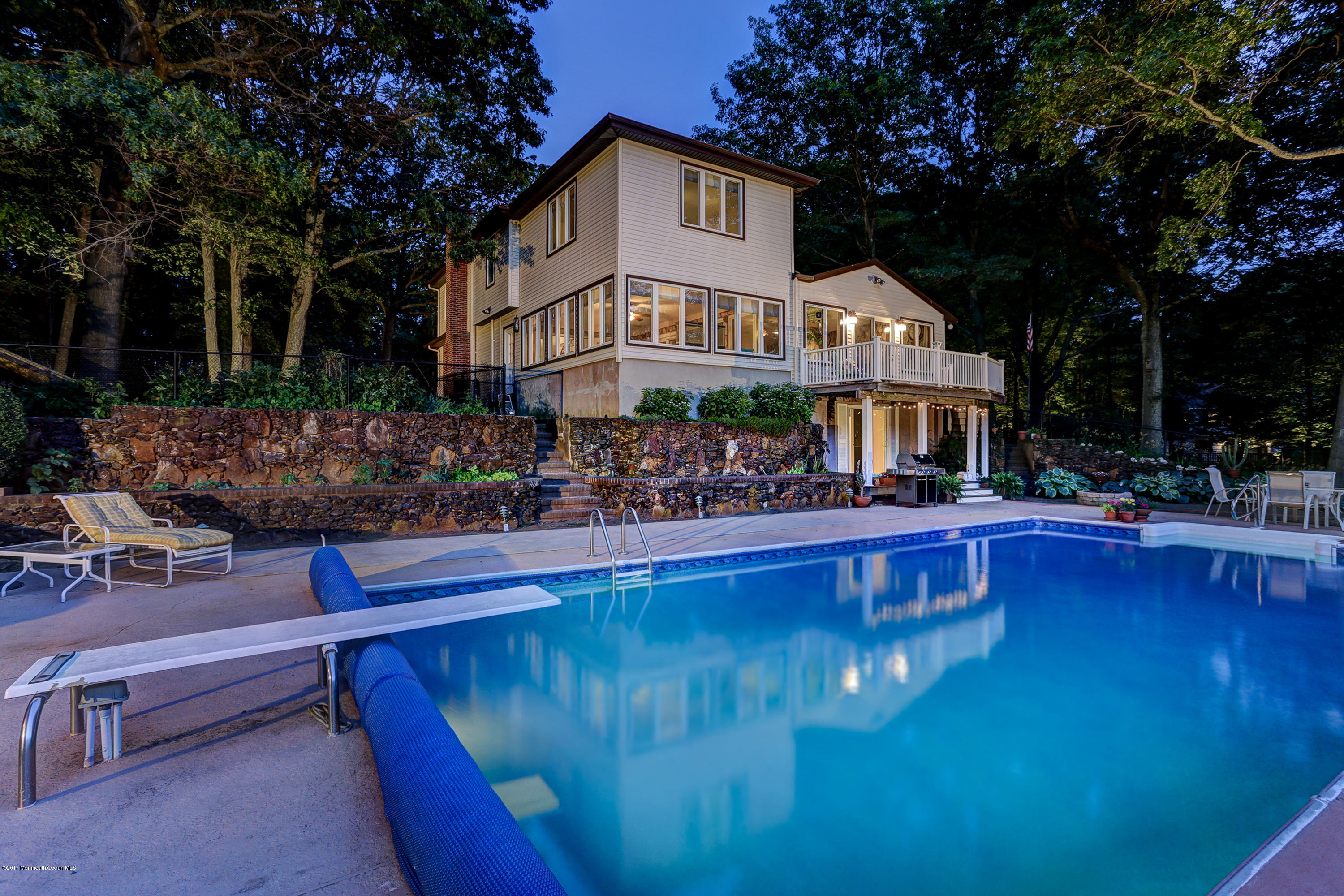 255 Portland Road Middletown, NJ 07737 - Photo 37 of 41 a front view of a house with swimming pool