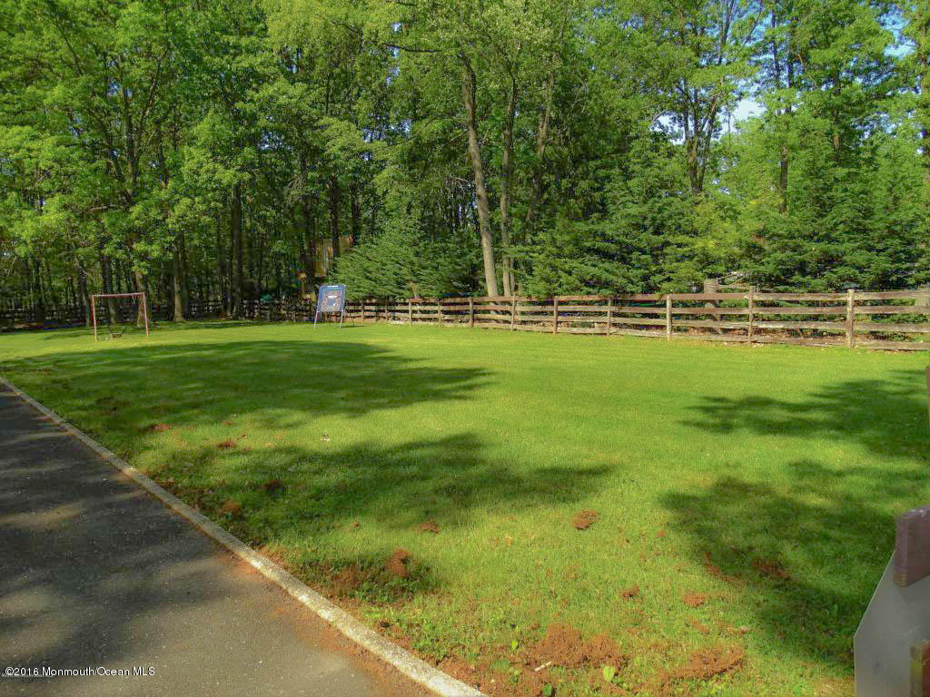 255 Portland Road Middletown, NJ 07737 - Photo 5 of 41 a view of a green yard