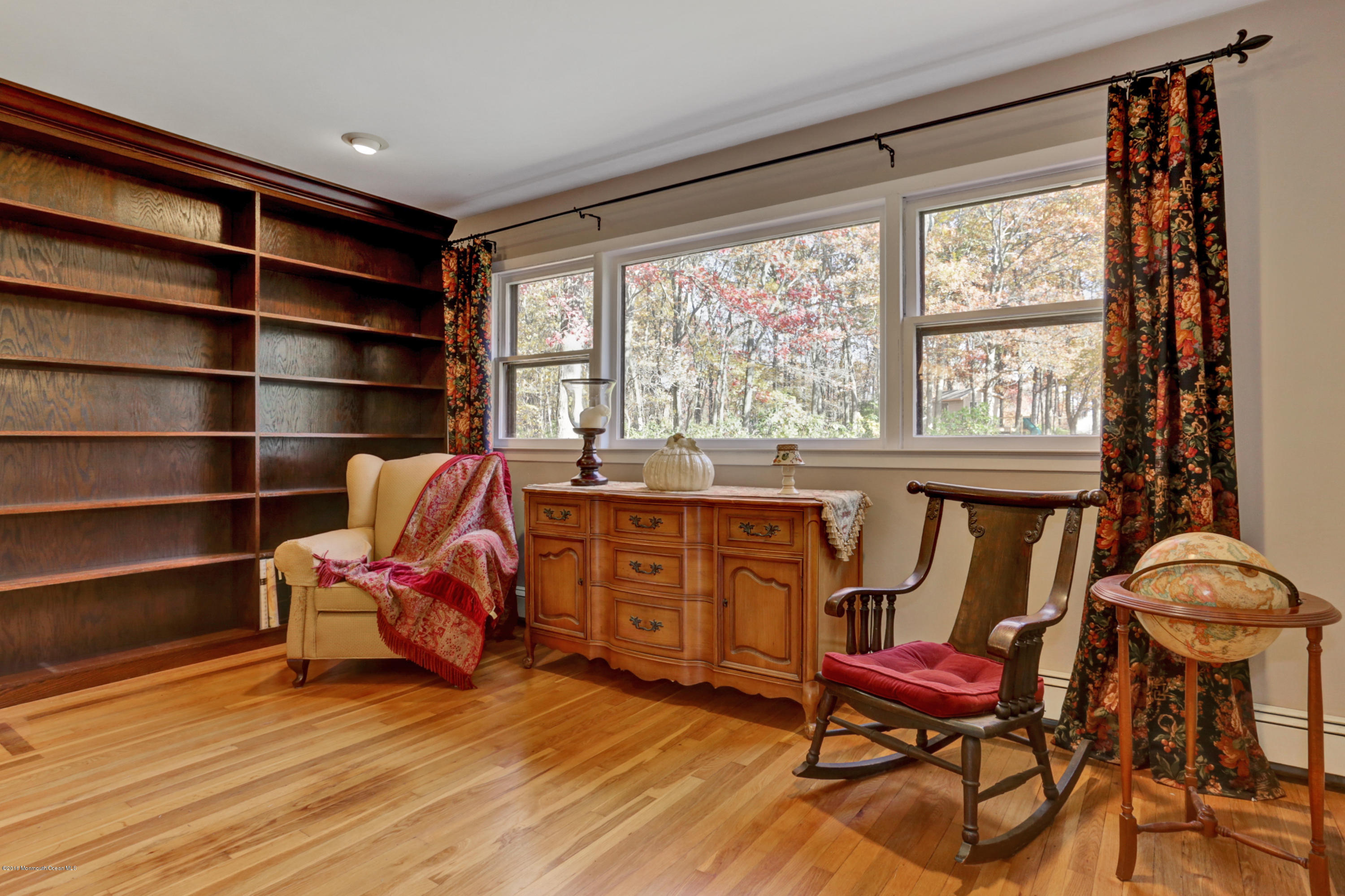 255 Portland Road Middletown, NJ 07737 - Photo 9 of 41 a living room with furniture a piano and a window