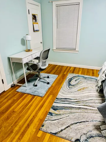 a view of a patio with a table and chairs