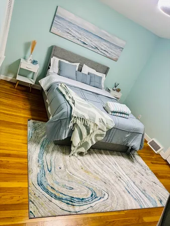 a bed sitting on a bed in a bedroom