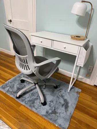 a bedroom with a bed and a mirror