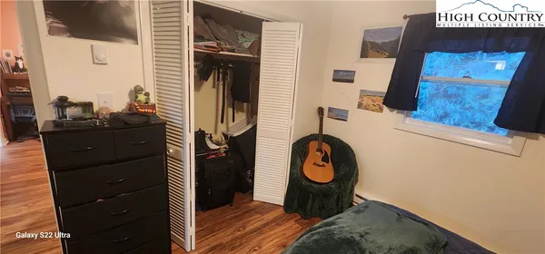 a view of a brick house with large windows