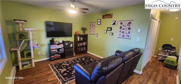 a room with furniture and a flat screen tv