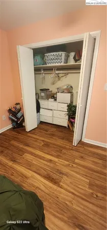 a bedroom with a bed and a mirror