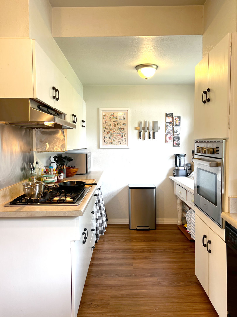 1108 West Daniel Street Champaign, IL 61821 - Photo 16 of 55 a kitchen with stainless steel appliances a sink and a stove