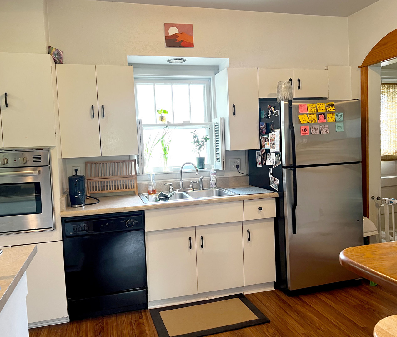 1108 West Daniel Street Champaign, IL 61821 - Photo 17 of 55 a kitchen with a sink refrigerator and cabinets