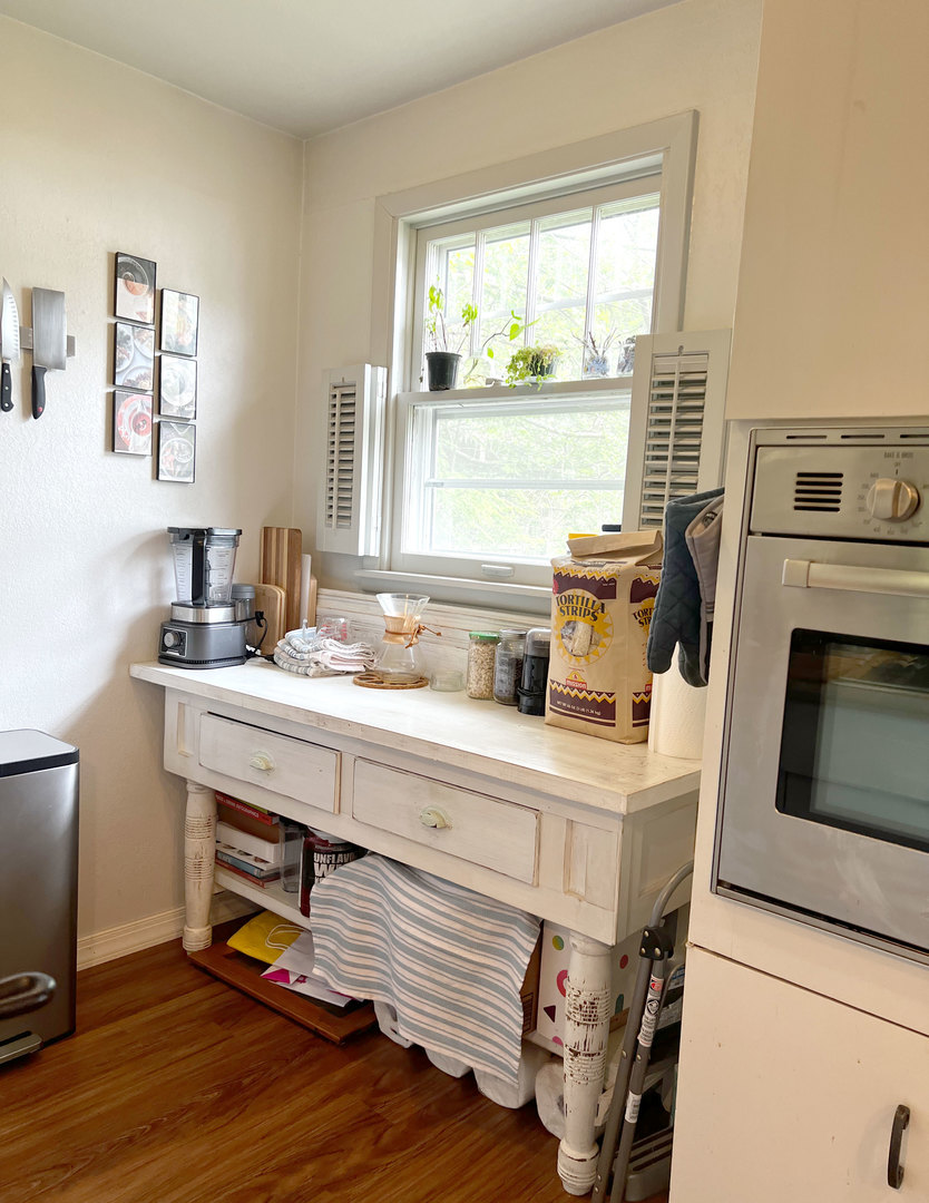 1108 West Daniel Street Champaign, IL 61821 - Photo 18 of 55 a kitchen with kitchen island a stove a sink and wooden floors