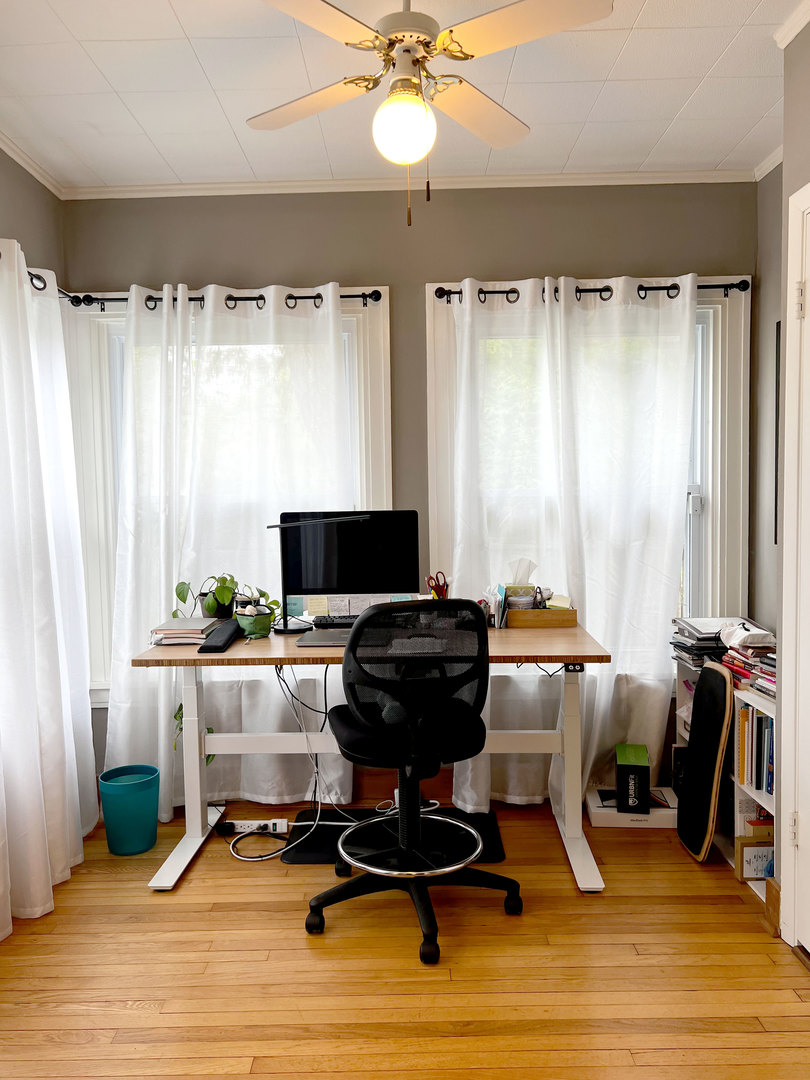 1108 West Daniel Street Champaign, IL 61821 - Photo 20 of 55 a view of a workspace with furniture and a window
