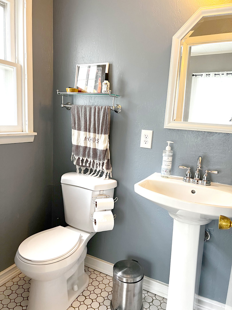 1108 West Daniel Street Champaign, IL 61821 - Photo 21 of 55 a bathroom with a sink a toilet and a mirror
