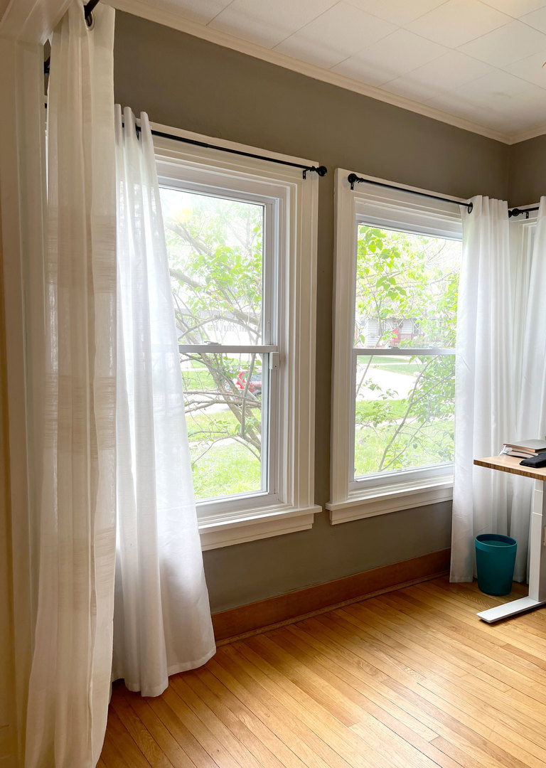 1108 West Daniel Street Champaign, IL 61821 - Photo 22 of 55 a view of an empty room with wooden floor and a window