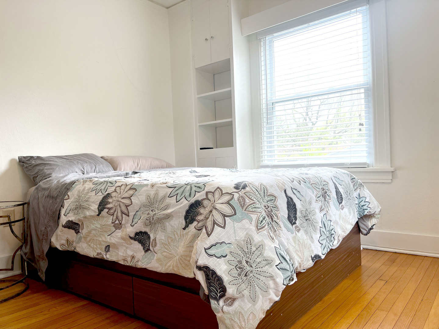 1108 West Daniel Street Champaign, IL 61821 - Photo 30 of 55 a bed sitting in a bedroom next to a window