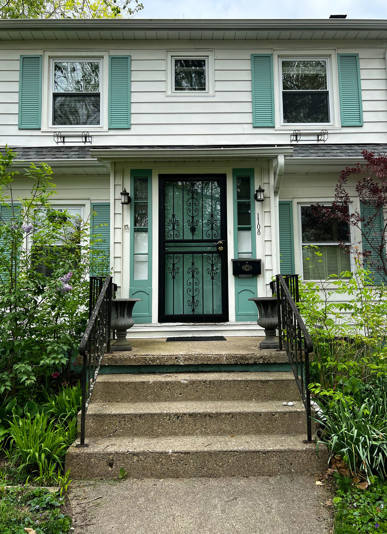 1108 West Daniel Street Champaign, IL 61821 - Photo 39 of 55 a view of a house with a fountain plants and large tree
