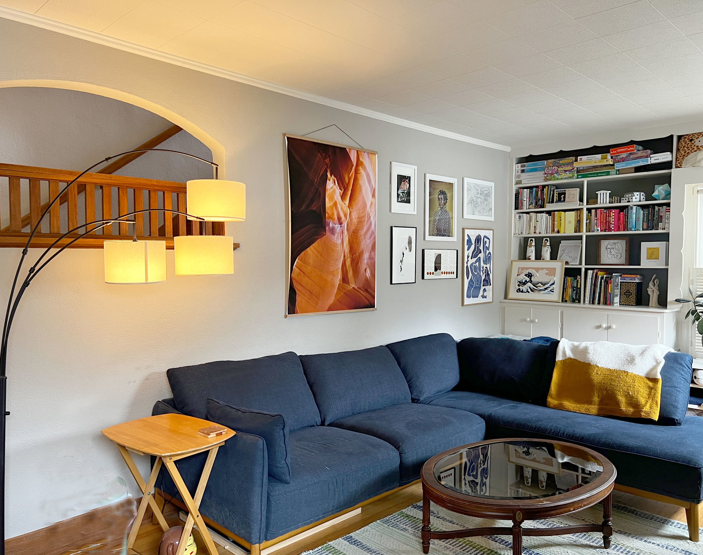 1108 West Daniel Street Champaign, IL 61821 - Photo 4 of 55 a living room with furniture a rug and a bookshelf