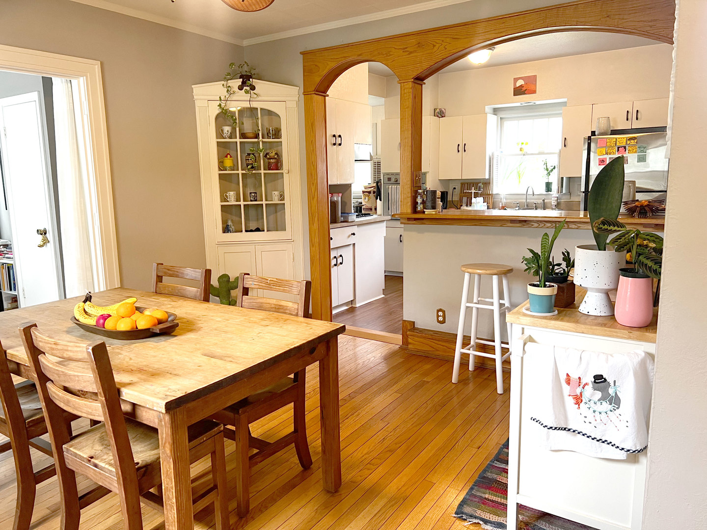 1108 West Daniel Street Champaign, IL 61821 - Photo 9 of 55 a dining room with stainless steel appliances granite countertop a dining table and chairs with the wooden floor