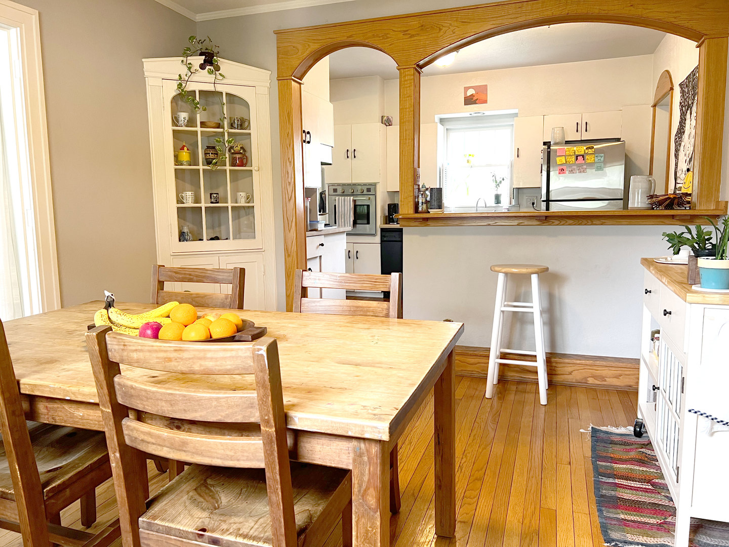 1108 West Daniel Street Champaign, IL 61821 - Photo 10 of 55 a dining hall with stainless steel appliances kitchen island granite countertop a dining table chairs and view of living room