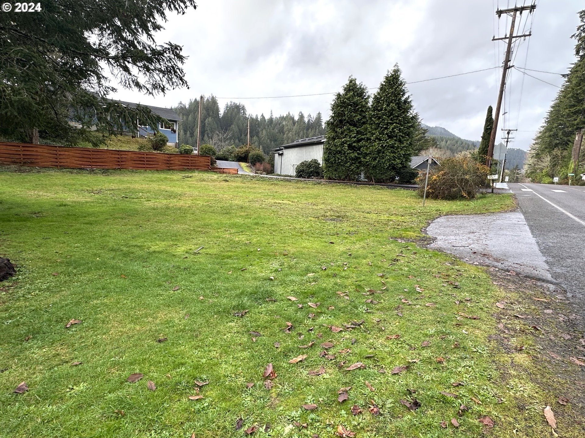 10887 East Mapleton Road Mapleton, OR 97453 - Photo 2 of 7 a view of a field of grass and trees