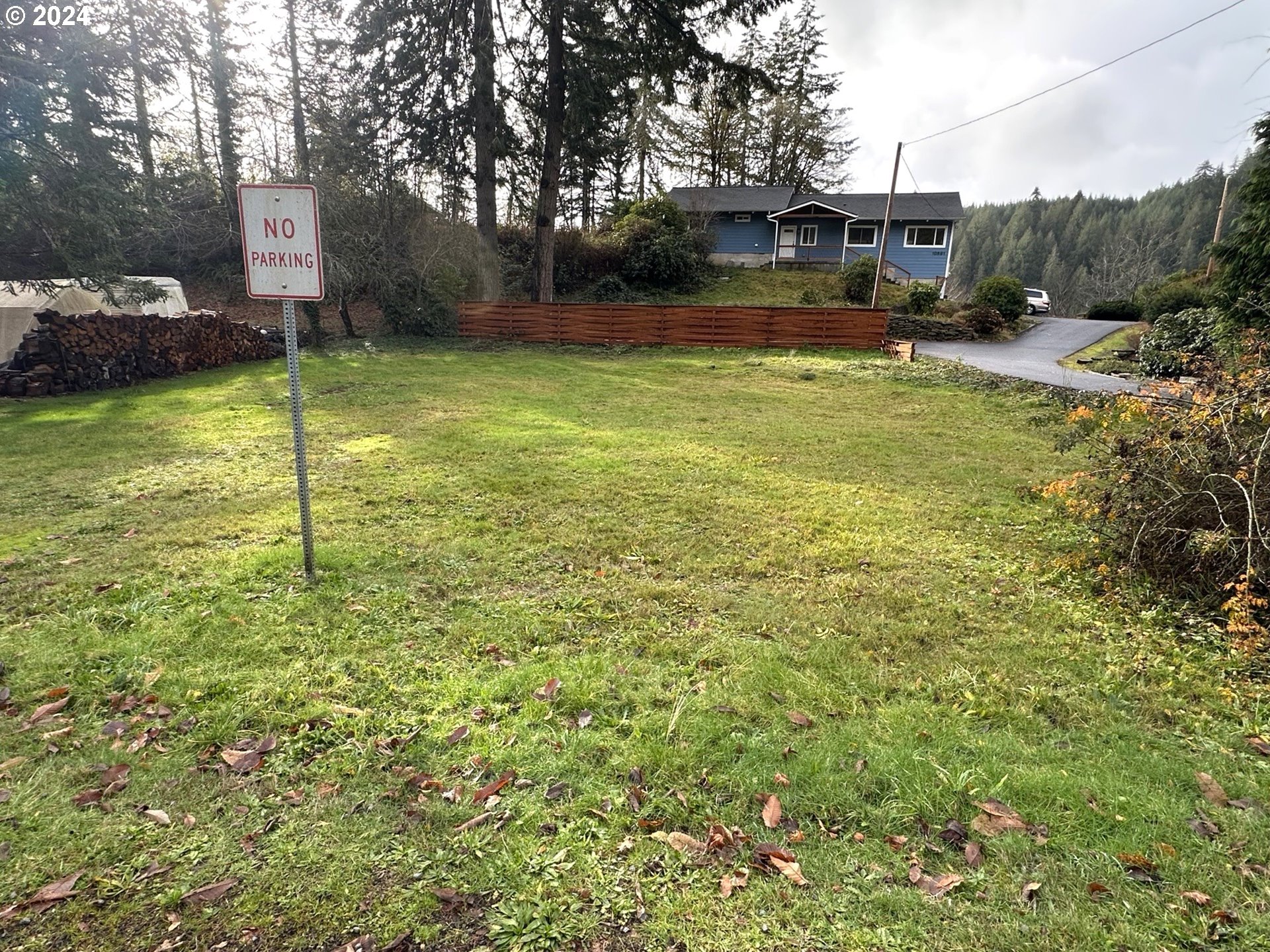 10887 East Mapleton Road Mapleton, OR 97453 - Photo 4 of 7 a view of a garden with a building in the background