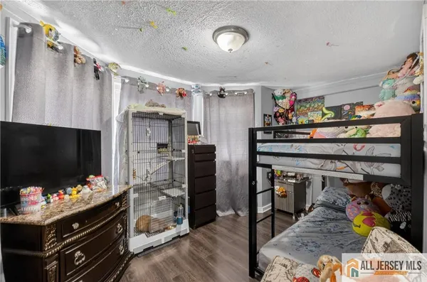 a kitchen with stainless steel appliances granite countertop a dining table chairs sink and cabinets