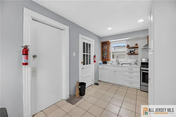 a bedroom with two beds and a dresser